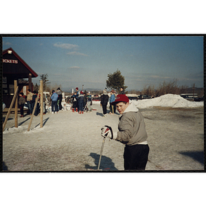 A boy stands on skis at a ski resort