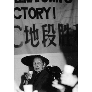 Guest attends a dinner at the Josiah Quincy School marking Chinatown's victory to build a community center on Parcel C