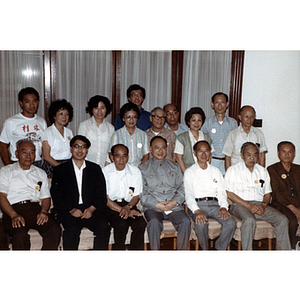 Men and women on an Association trip to China sit in a group