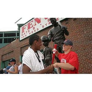 Torch Scholars Michael Toney and Joseph Bordieri outside Fenway Park