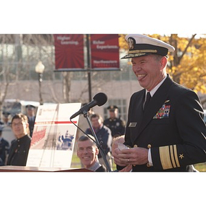 Vice Admiral Mark Fitzgerald sticks out his tongue at the Veterans Memorial dedication ceremony