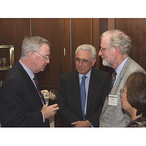 Dr. William Hancock, right, and John Hatsopoulos, center, talk with unidentified man at gala dinner