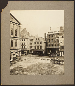 View of commercial buildings and street traffic, Dock Square