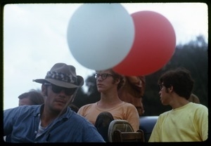 Audience members with balloons at the Woodstock Festival