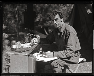 Harry George Higbee, naturalist, at his field desk in the Moose Hill Wildlife Sanctuary