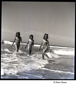 Lucy Simon, unidentified girl, and Carly Simon play in the ocean