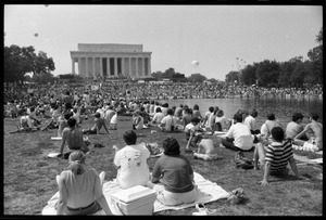 Crowd seated by the Reflecting Pond on the Mall watching speakers at the Lincoln Memorial, 25th Anniversary of the March on Washington