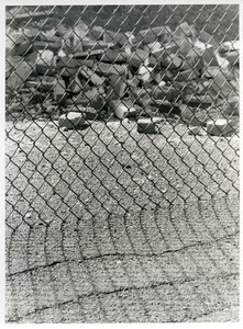 Chain link with brick pile