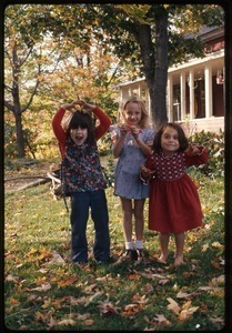 Three girls in front yard of the house, Montague Farm Commune