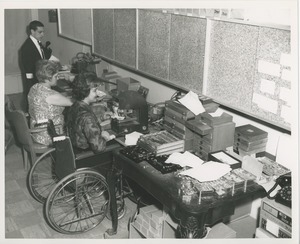 June Trietsch Arzt operating an embosser in her wheelchair