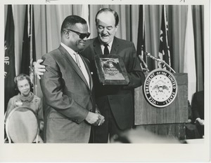 Vice President Hubert Humphrey presents Art Edgerton with the 1966 President's Trophy