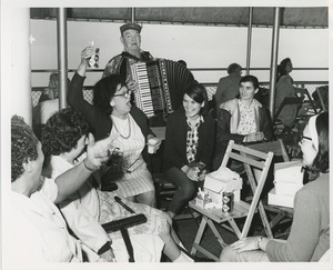 Accordionist and group on boat ride
