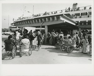 Wheelchair users waiting to board boat