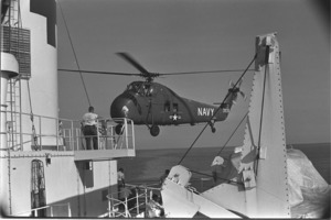 Medivac helicopter landing on the Repose hospital ship.