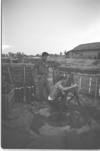 U.S. special force firing mortar at Tan Phu; Mekong Delta.