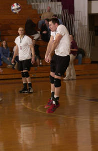 Brandon Mueller volleying the ball