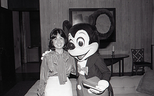 Woman with Disney character Mickey Mouse