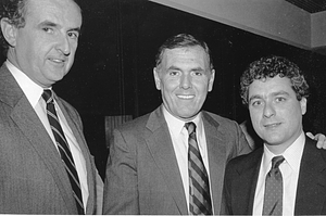 Mayor Raymond L. Flynn posing with two unidentified men