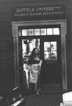 Students exiting Suffolk University's College of Business Administration building (45 Mount Vernon Street), photograph, 1980