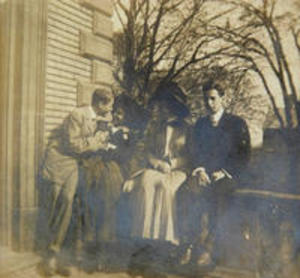 Two couples outside of Sigma Phi fraternity house, 1908
