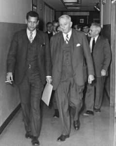 Julian Bond and Suffolk University President John E. Fenton (1965-1970) walk down hallway before Bond's address to students.