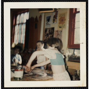 Several boys and girls working on projects for their art class at the South Boston Boys' Club