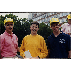 Executive Director Jerry Steimel (right), a woman, and a man pose for a shot during the Battle of Bunker Hill Road Race