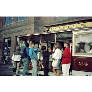 Male Association member stands on a trolley