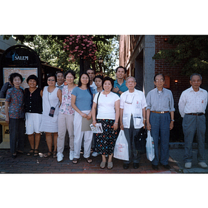 Chinese Progressive Association members pose in a group on a street corner in Salem, Massachusetts