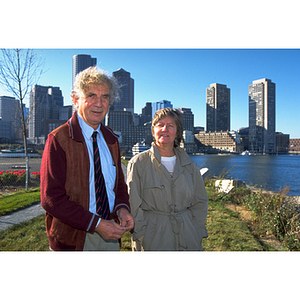 Professor of Economics Gustav Schachter, left, and Executive Vice Provost Daryl Hellman, right, stand in front of the Boston skyline