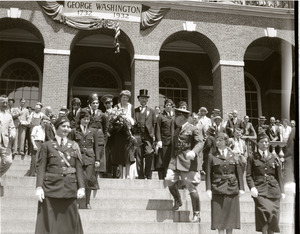 Amelia Earhart reception: Earhart with bouquet of flowers, standing atop the Massachusetts State House steps with entourage