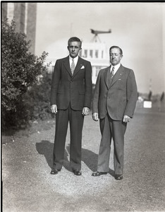 Bill Wincapaw (son) and William H. Wincapaw (the "Flying Santa Claus"), in business attire, l. to r.