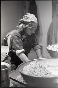 Unidentified member working in commune-owned kitchen (possibly Zapmia Pizza)