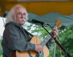 David Crosby: half-length portrait with acoustic guitar, on stage at the Clearwater Festival