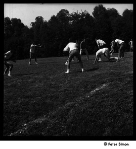 Camp Arcadia: campers playing touch football (hiking the football)