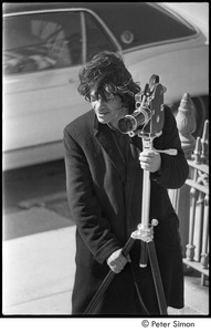 Jack Kerouac's funeral: Gregory Corso setting up film camera outside of church