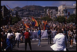 Massive crowd with pride flags marching in the San Francisco Pride Parade