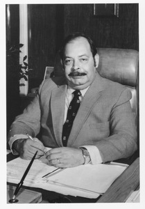 Jose L. Monserrate at his desk
