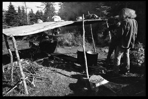 Two men standing by a makeshift shelter, Earth People's Park