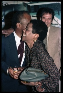 James Baldwin hugging Esther Terry at his 60th birthday celebration, UMass Campus Center