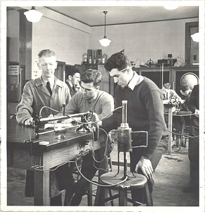 Professor C. Neale Stacy helping two students at Springfield College (c. 1940)