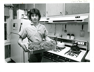 House of Hope volunteer Paul Santos serves up meat loaf