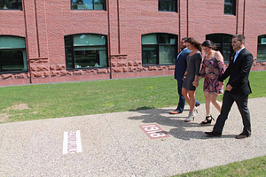 Benjamin Morales, Dina Pitsas, Amanda Crane, and David Zaldivar standing on senior walk at Springfield College (September 2016)