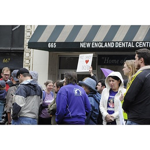 Closely packed observers watch the "One Run" race outside the New England Dental Center in Copley Square