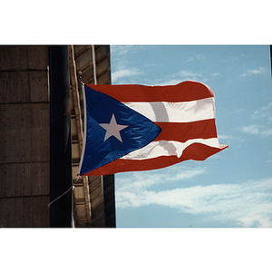 The Puerto Rican flag flies from a flagpole