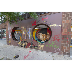 Harriet Tubman House The Honor Roll Mural on Columbus Avenue through facade from right