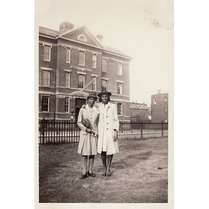 "Winnie" Irish poses with an unidentified woman in front of the Sherwin School
