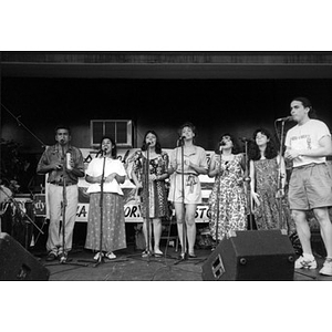 Singing group performing on an outdoor stage at Festival Betances.