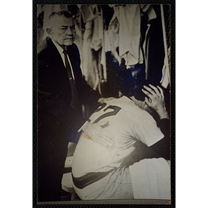 A photograph of an image of Red Sox owner Tom Yawkey consoling catcher Carlton Fisk after the team was eliminated from the playoffs on October 3, 1972
