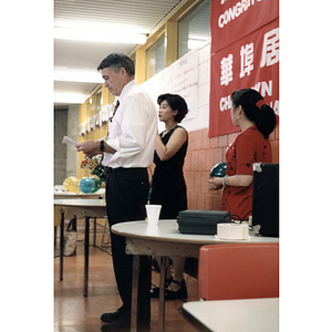 Woman addresses members of the Chinese Resident Association at a celebration